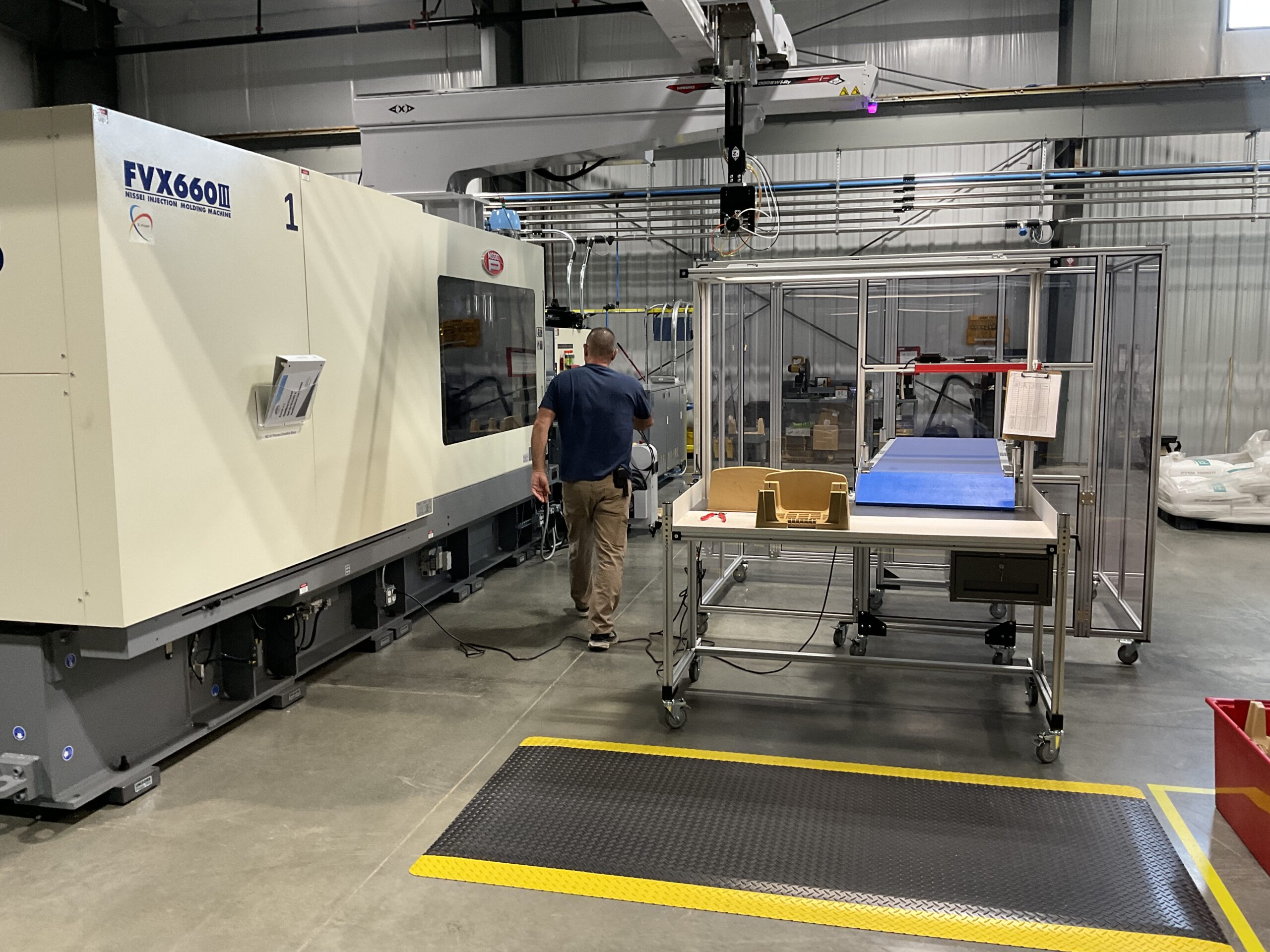 Plastic injection molding machine in production